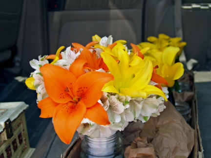 Bridal bouquet of orange and yellow asiatic lilies among white alstromeria 